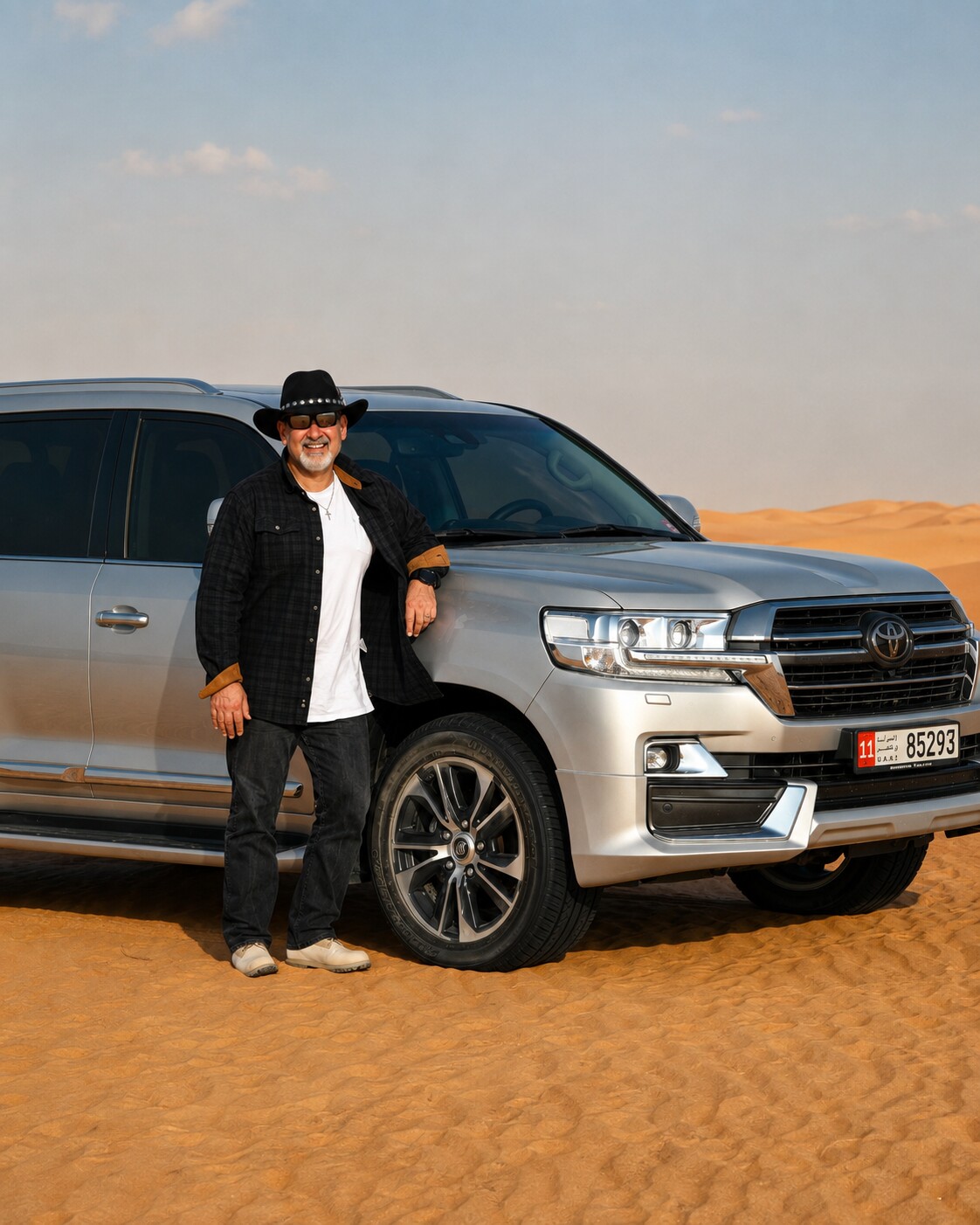TranSaharian founder Rizkallah Ward beside his Land Cruiser in the UAE desert
